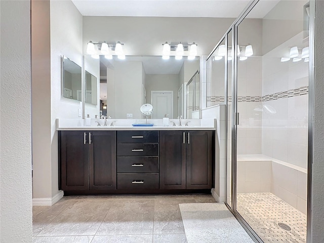 bathroom with an enclosed shower and vanity