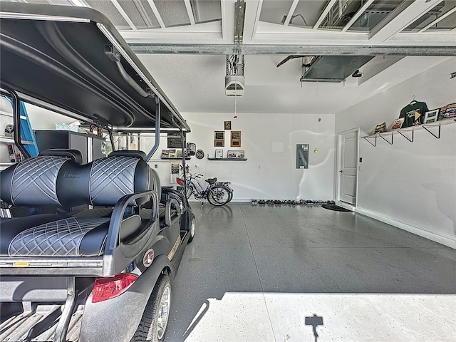 garage with a garage door opener and electric panel