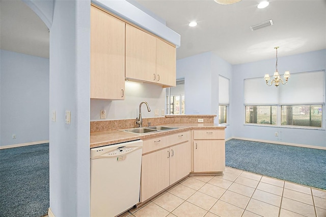 kitchen with dishwasher, sink, light colored carpet, and light brown cabinetry