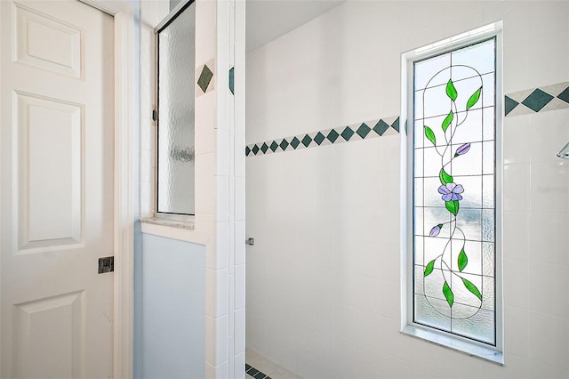 bathroom with tiled shower