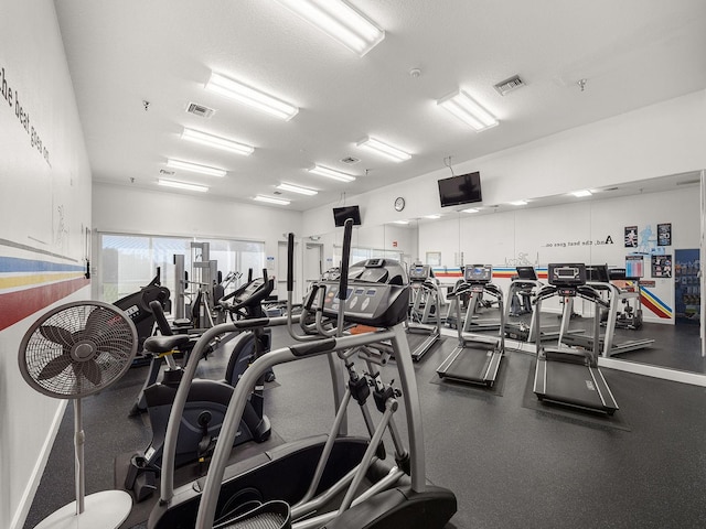 gym featuring a textured ceiling