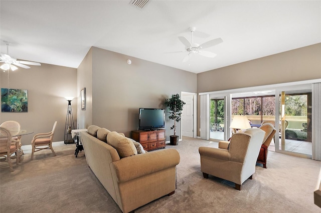 living room featuring high vaulted ceiling, light colored carpet, and ceiling fan