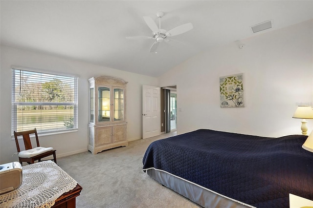 carpeted bedroom featuring ceiling fan and lofted ceiling