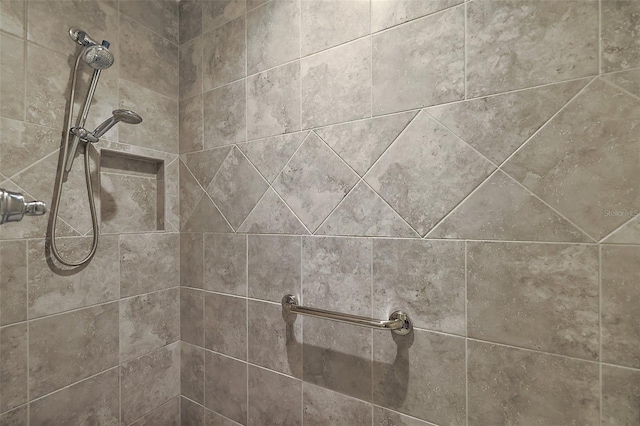 room details featuring a tile shower