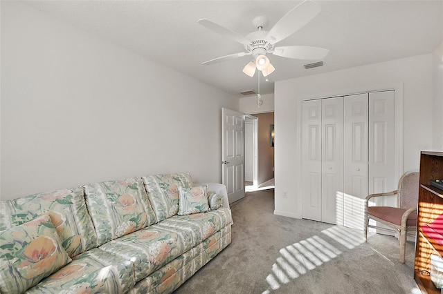 living room with carpet flooring and ceiling fan