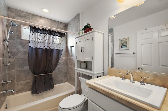 full bathroom featuring vanity, shower / tub combo, and toilet