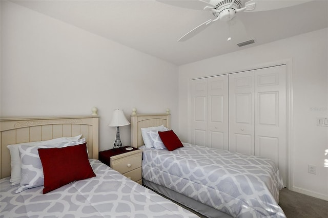 bedroom featuring a closet, ceiling fan, and carpet