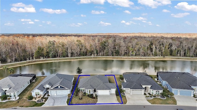 birds eye view of property featuring a water view