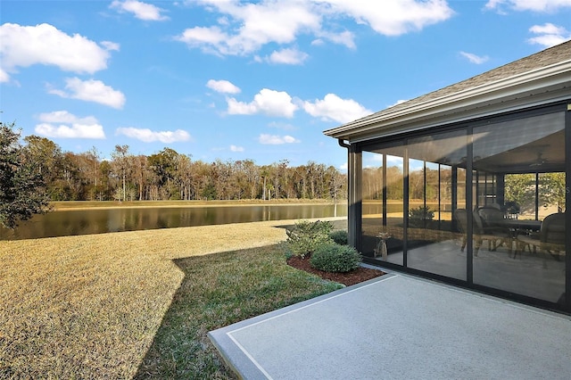 view of yard with a patio area and a water view