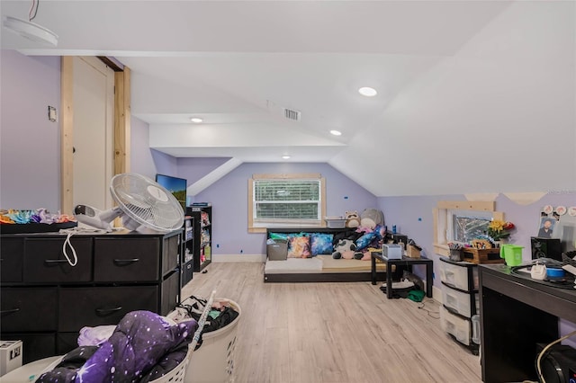 interior space featuring lofted ceiling and light wood-type flooring