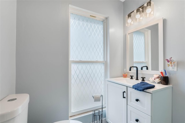 bathroom with vanity and toilet