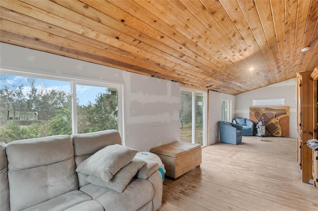 interior space with vaulted ceiling, wood ceiling, and light hardwood / wood-style flooring