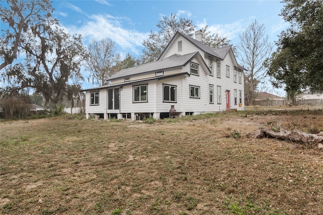 view of side of property featuring a yard