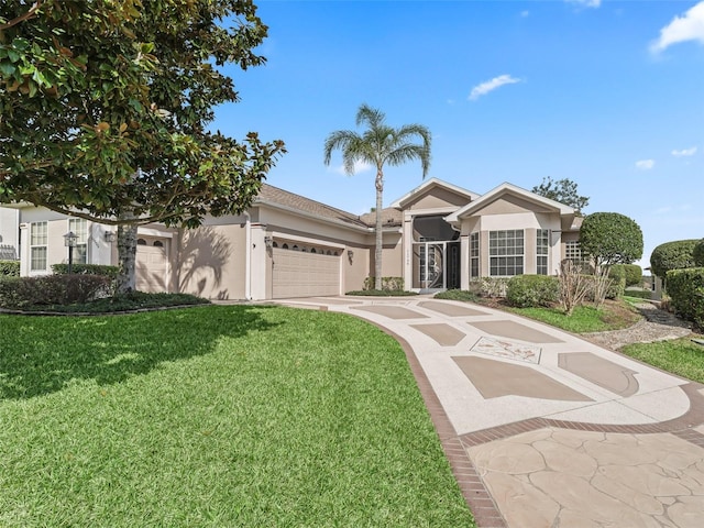 view of front of house featuring a garage and a front yard