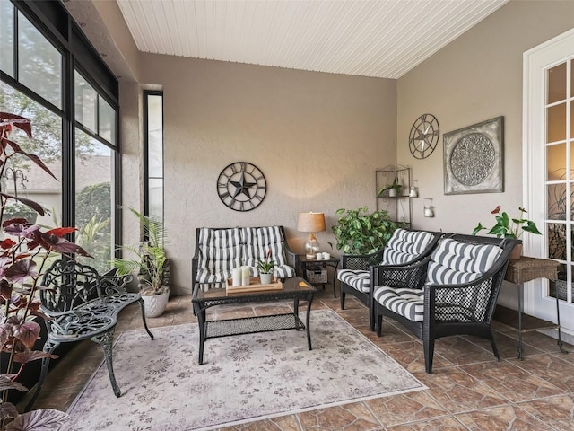 sunroom / solarium featuring wood ceiling