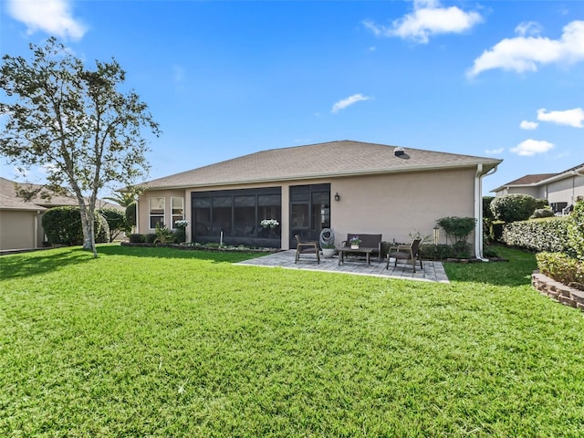 back of house featuring a yard and a patio area