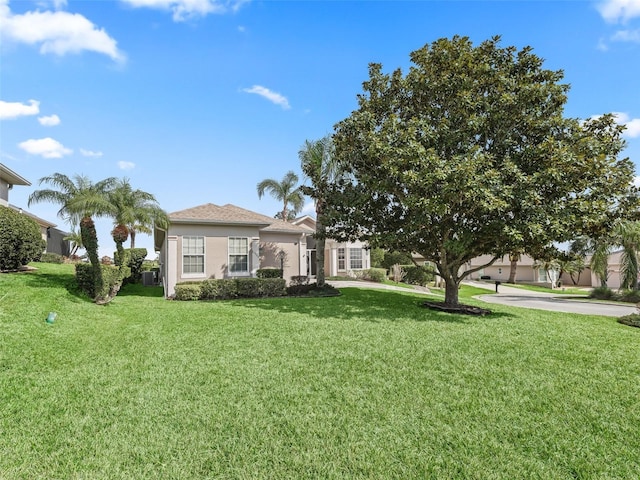 view of front of home with a front lawn