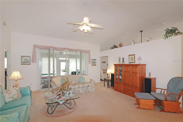 carpeted living area featuring a ceiling fan and high vaulted ceiling