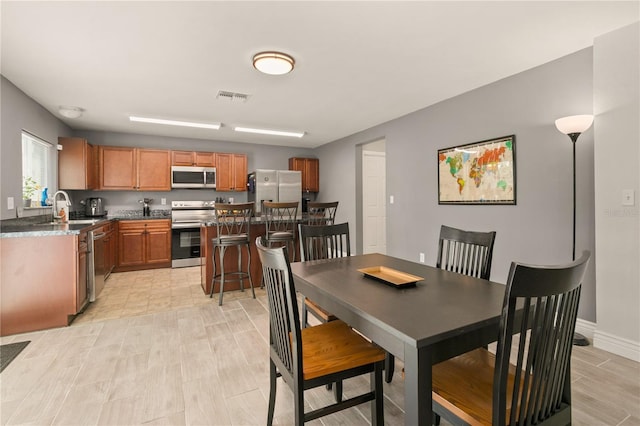 dining space featuring sink