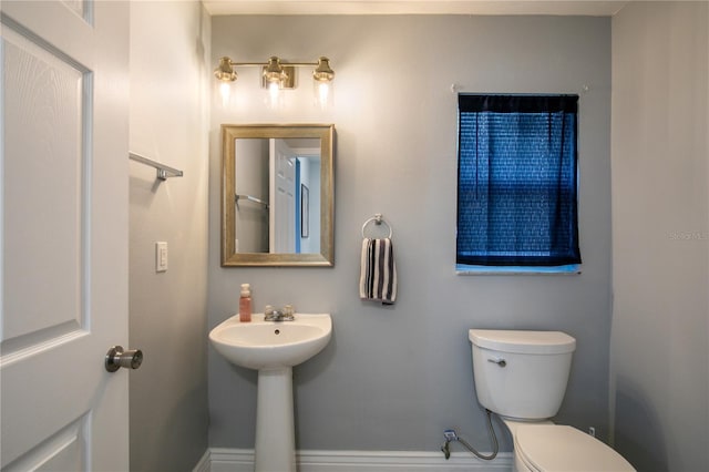 bathroom with sink and toilet