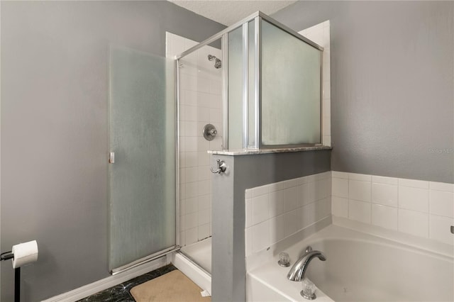 bathroom with shower with separate bathtub