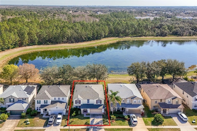 birds eye view of property featuring a water view