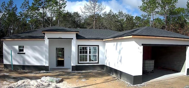 view of side of home with a garage