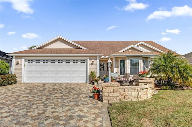 ranch-style home featuring a garage and a front yard