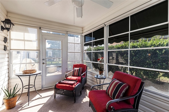 sunroom / solarium featuring ceiling fan