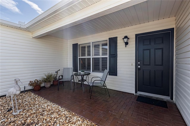 doorway to property featuring a porch