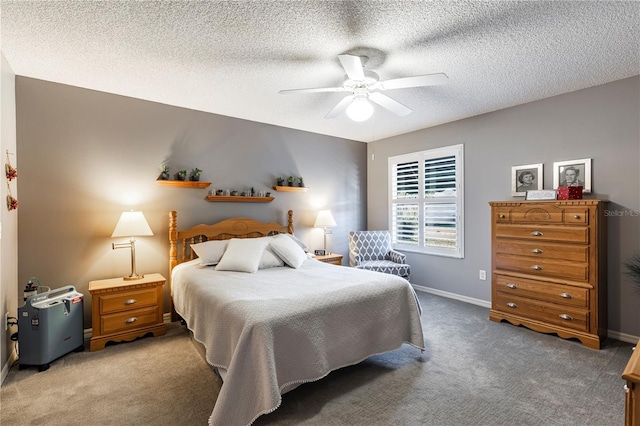 bedroom with a textured ceiling, ceiling fan, and carpet