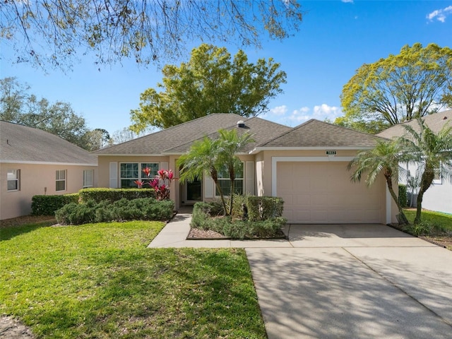 ranch-style house featuring a garage and a front yard