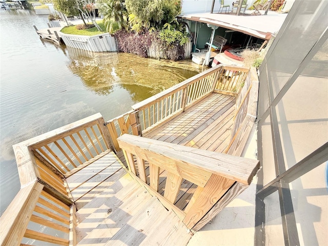 wooden deck featuring a water view