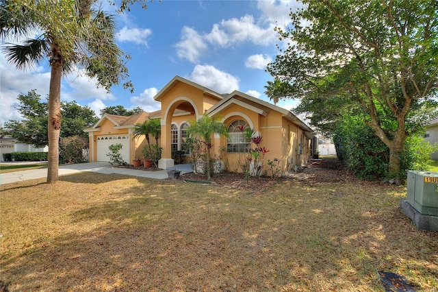 view of front of property featuring a garage and a front yard