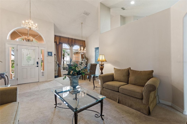 living room featuring a notable chandelier, light tile patterned floors, and high vaulted ceiling