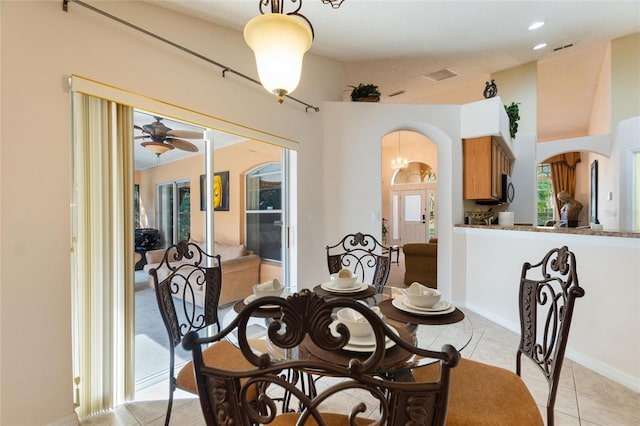 dining room with light tile patterned floors and ceiling fan