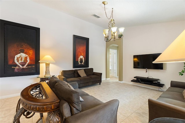 tiled living room with an inviting chandelier