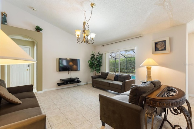 tiled living room featuring lofted ceiling, a chandelier, and a textured ceiling