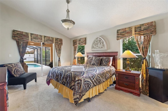 bedroom featuring multiple windows, vaulted ceiling, access to outside, and light colored carpet