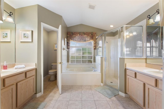 full bathroom with tile patterned flooring, vanity, vaulted ceiling, independent shower and bath, and toilet