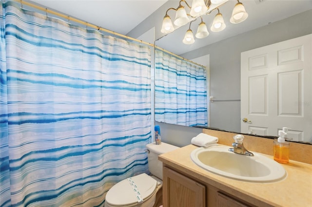 bathroom featuring a shower with curtain, vanity, and toilet