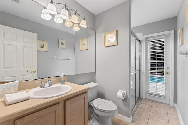 bathroom with tile patterned flooring, vanity, walk in shower, toilet, and an inviting chandelier