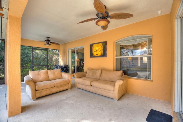 living room with ceiling fan and light carpet