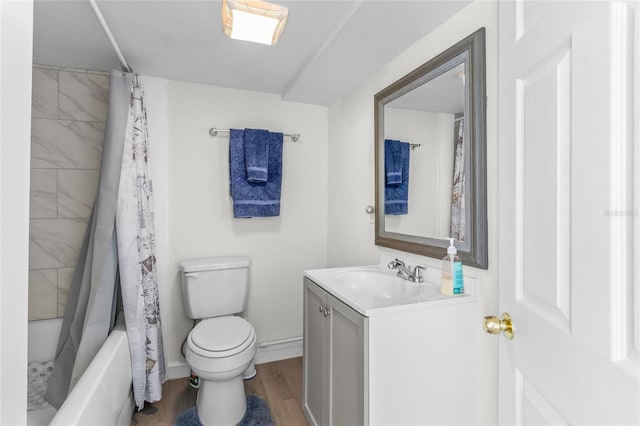 full bathroom featuring shower / tub combo with curtain, vanity, hardwood / wood-style floors, and toilet