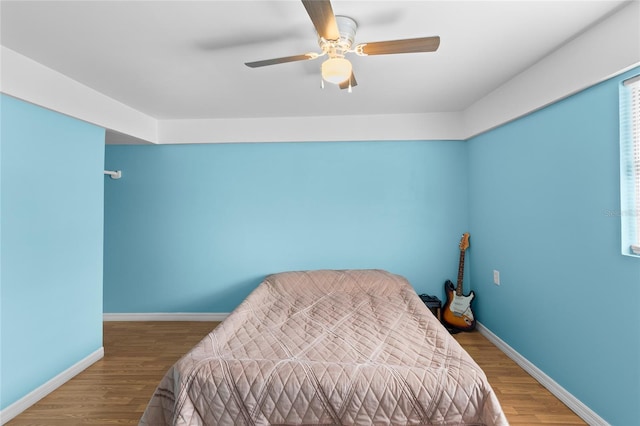 bedroom featuring wood-type flooring and ceiling fan