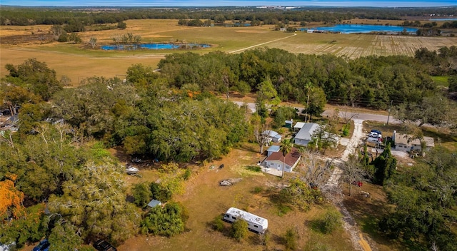 birds eye view of property with a water view and a rural view