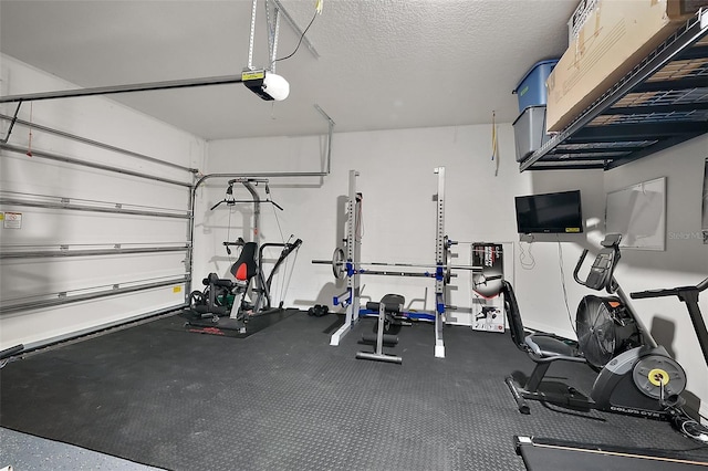 exercise area featuring a textured ceiling