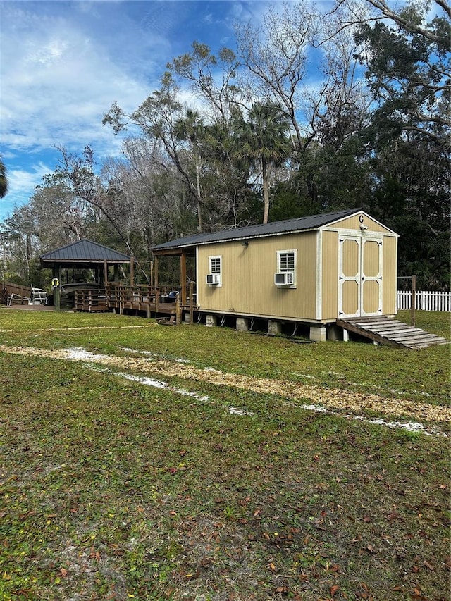 view of yard featuring a gazebo and a shed