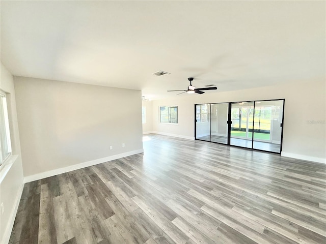 spare room featuring light hardwood / wood-style flooring and ceiling fan