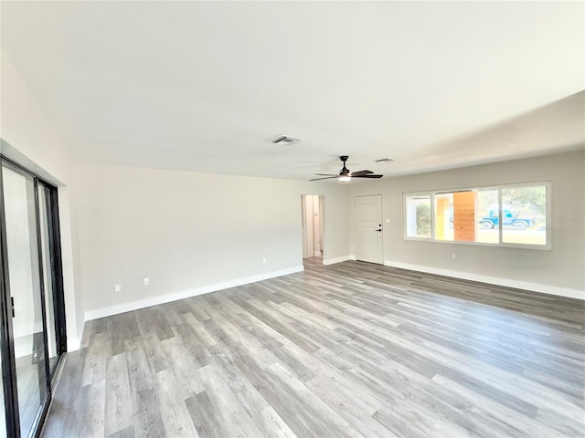 unfurnished living room with light hardwood / wood-style flooring and ceiling fan